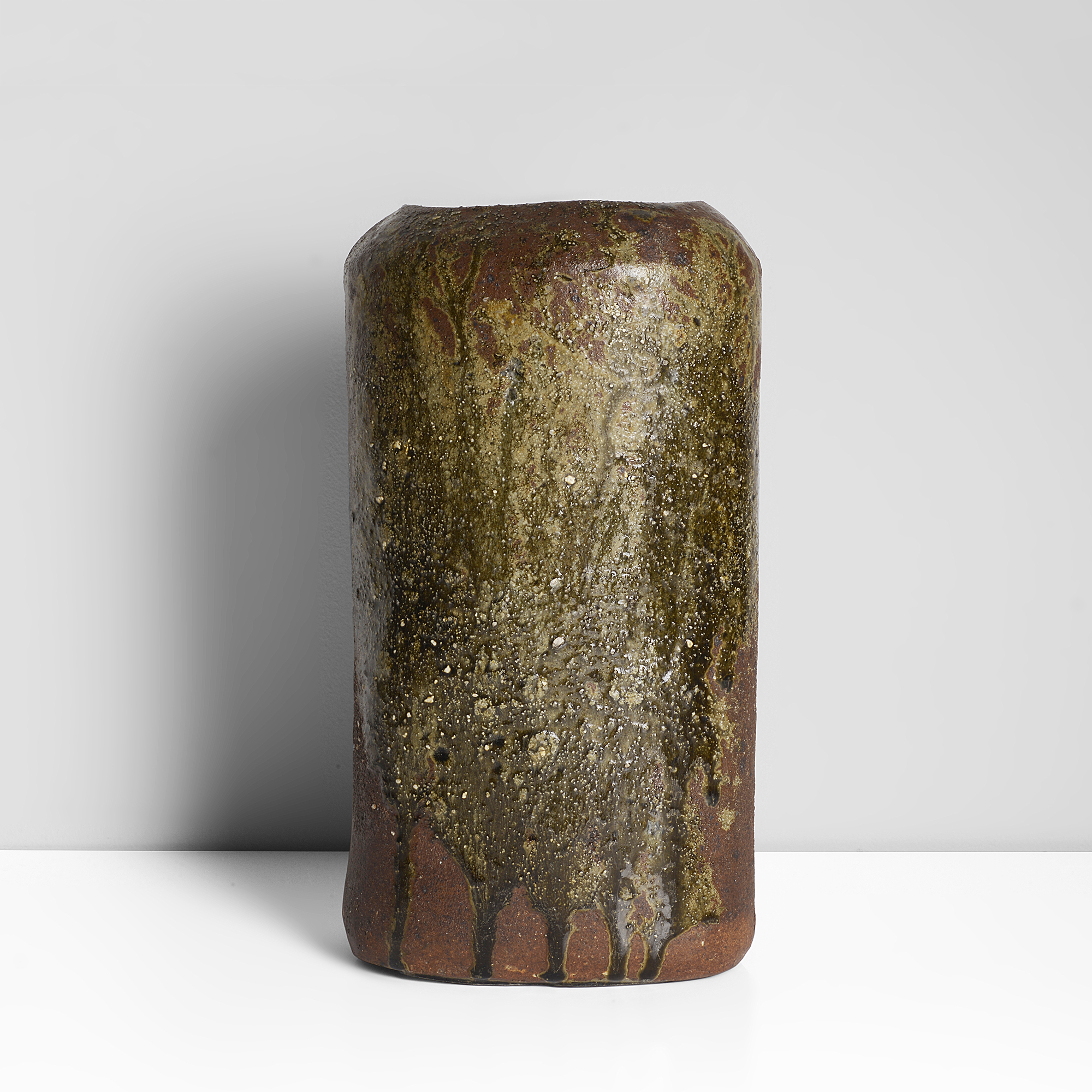 Janet Leach | Stoneware, running green glaze over dry red brown body with feldspar inclusions, impressed JL and Leach Pottery seals