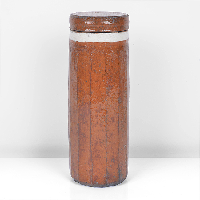 An orange raku tall lidded vessel made by Inger Rokkjaer in 2005 sold at auction by Maak Contemporary Ceramics