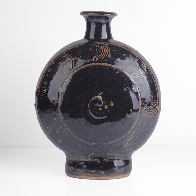 A tenmoku stoneware pilgrim bottle made by Bernard Leach in circa 1960 sold at auction by Maak Contemporary Ceramics