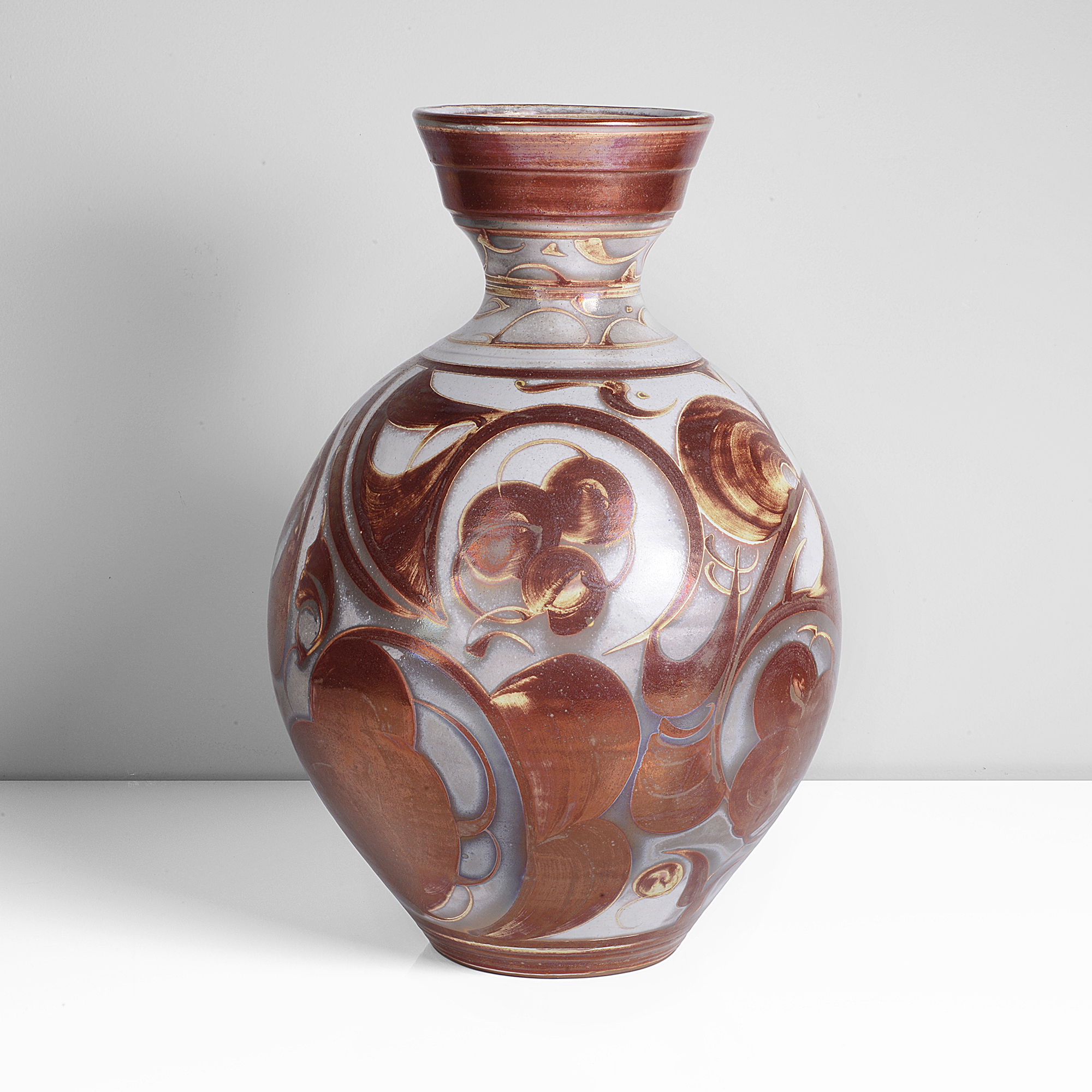 A earthenware with red lustre large bottle vase made by Alan Caiger-Smith in 1984 sold at auction by Maak