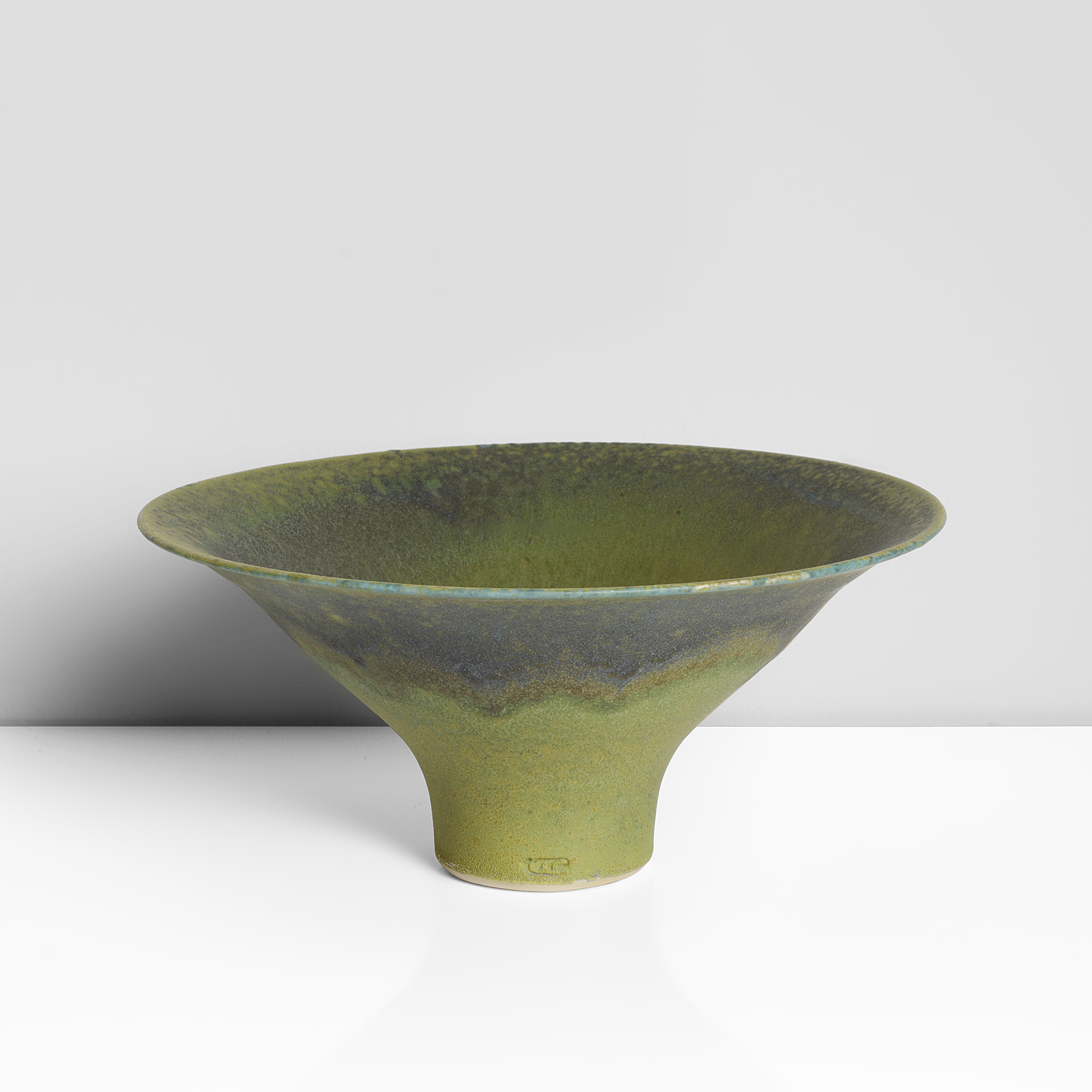 A green stoneware footed bowl made by Abdo Nagi sold at auction by Maak
