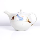 A cream celadon glaze porcelain teapot made by Geoffrey Whiting sold at auction by Maak Contemporary Ceramics
