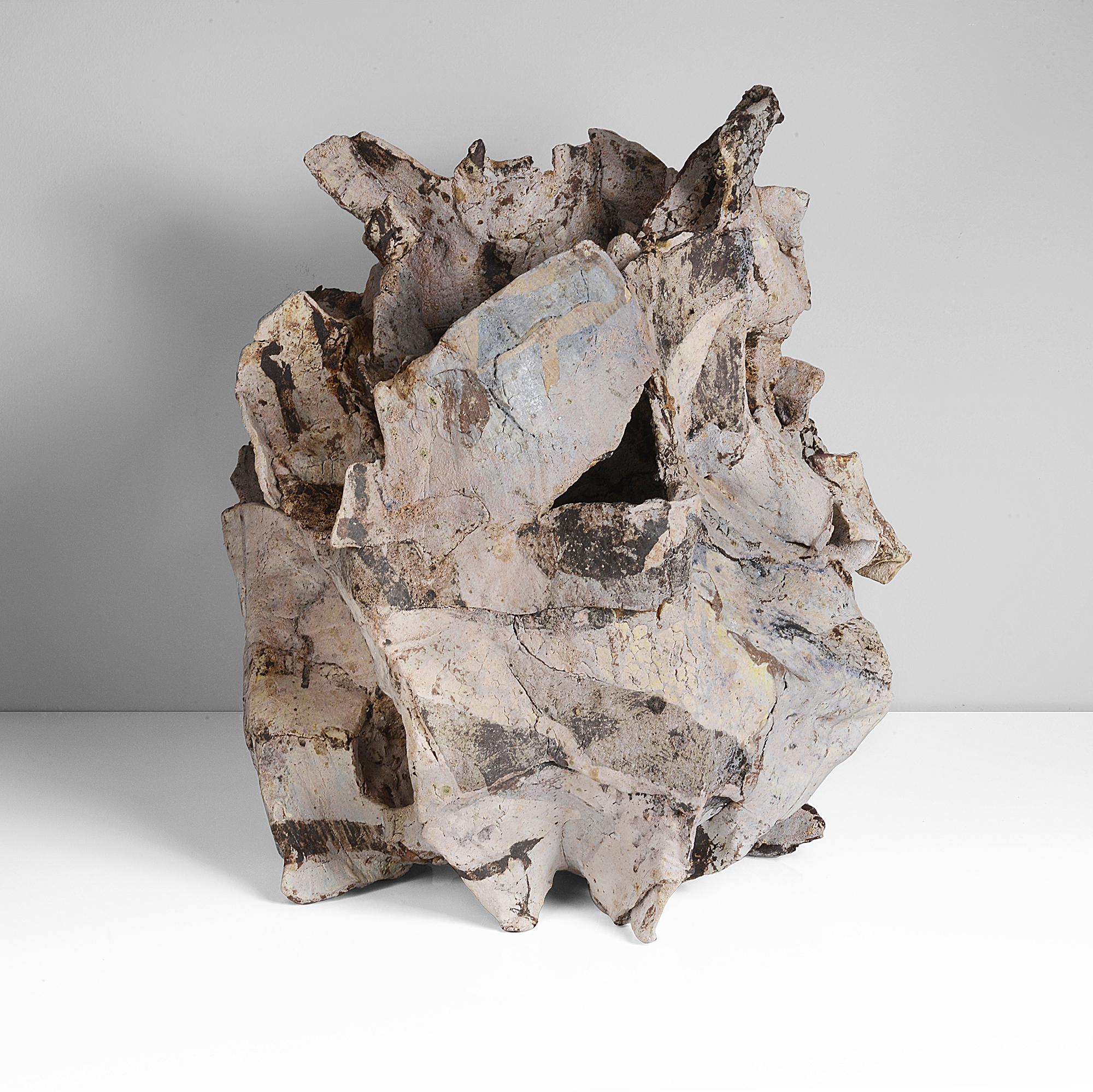 A mixed laminated clay sculptural form made by Ewen Henderson in 1988