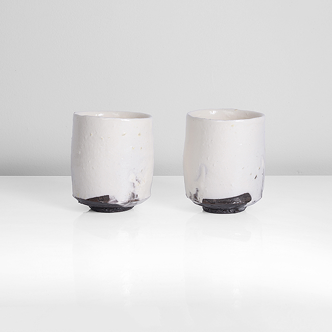A pair of stoneware kohiki yunomi made by Tsujimura Shiro sold at auction by Maak