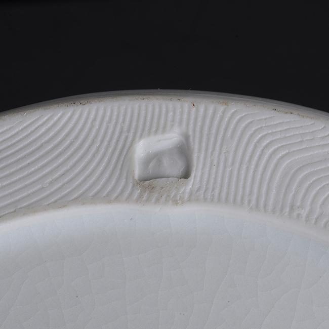 An impressed maker's mark on a pale blue celadon porcelain lidded jar made by Edmund de Waal sold at auction by Maak Contemporary Ceramics