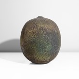 A green and brown stoneware vessel made by Erna Aaltonen in 2007