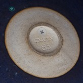 An incised signature on a bowl made by Alev Ebuzziya Siesbye sold at auction by Maak