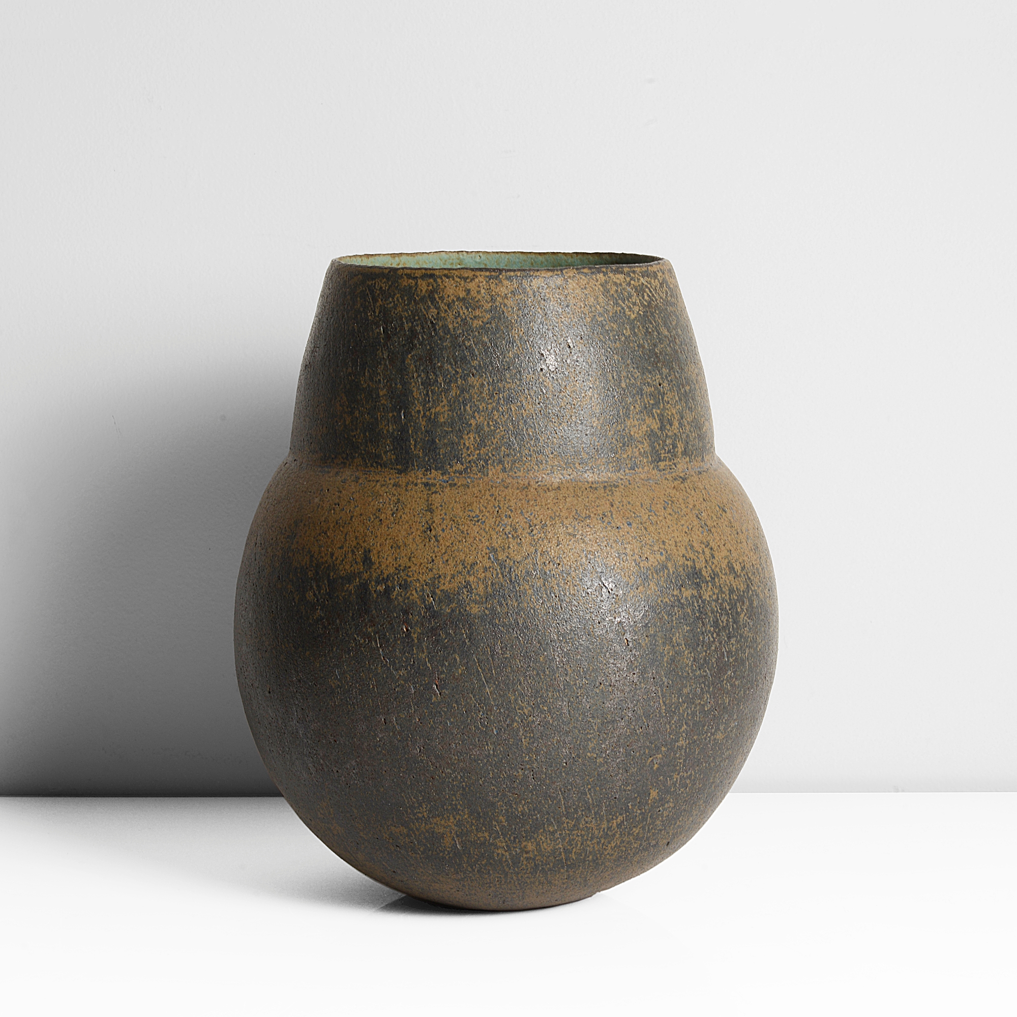 A stoneware pot with broad collar made by John Ward