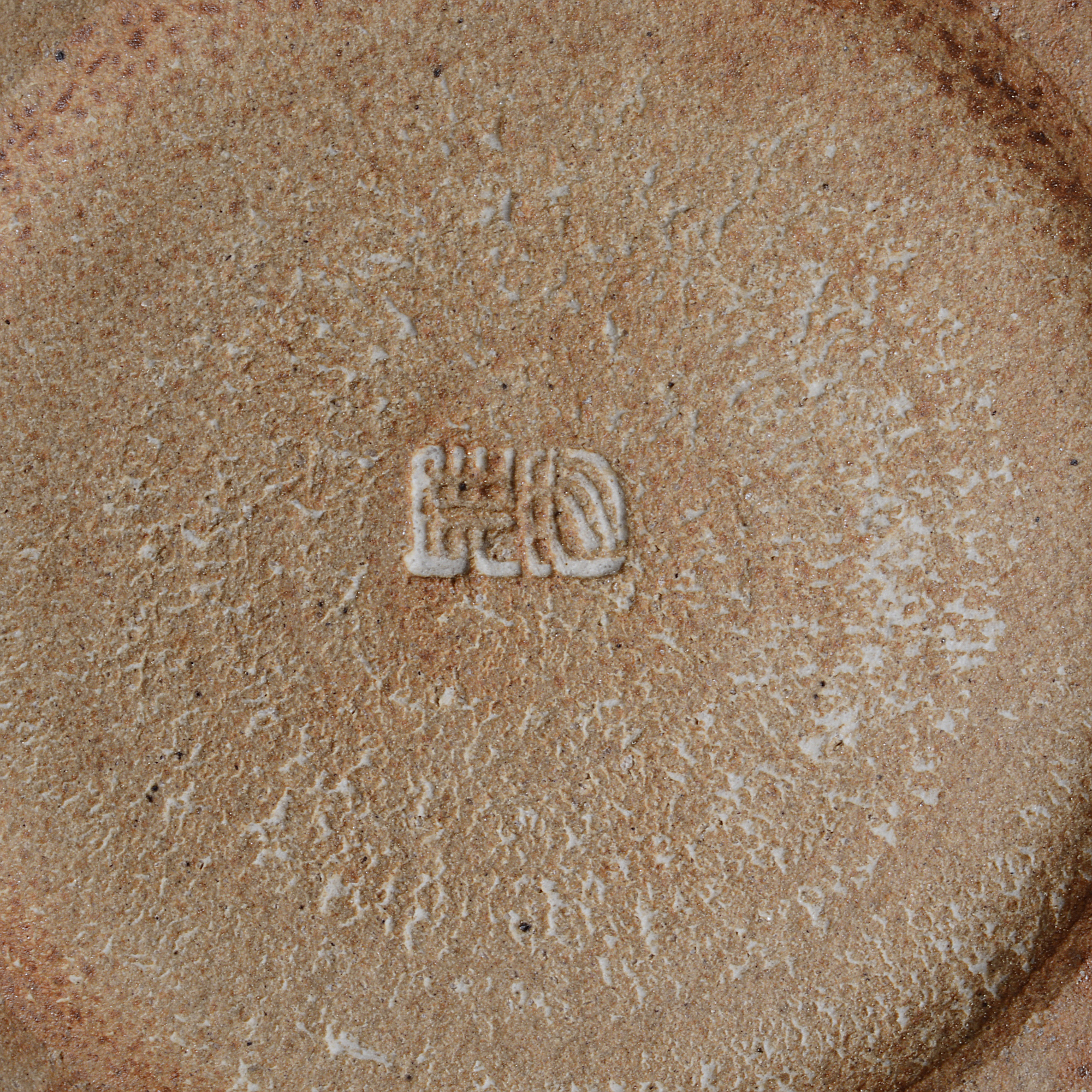 An impressed maker's mark on a tamba vase made by Ichino Masahiko sold at auction by Maak