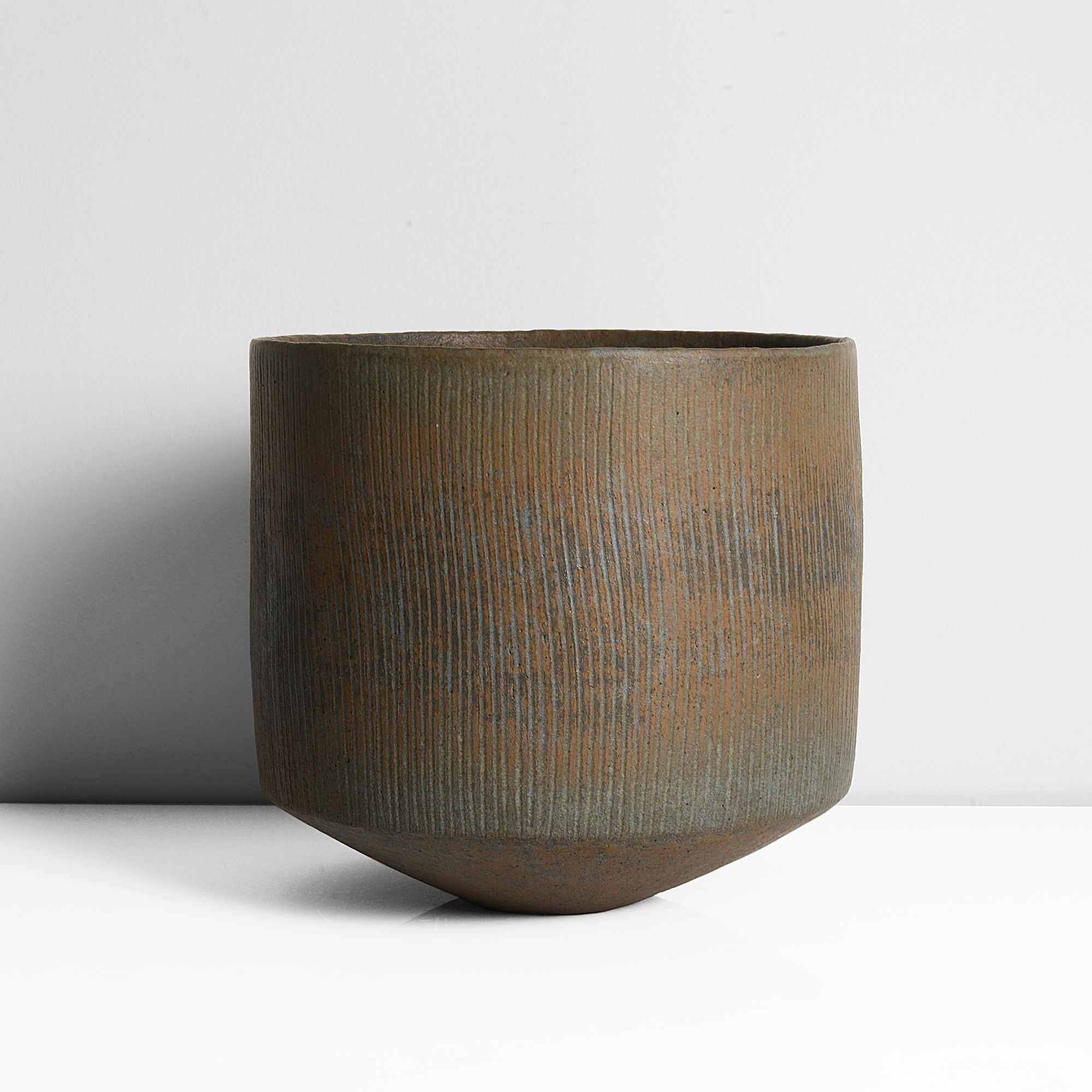 A stoneware deep bowl made by John Ward