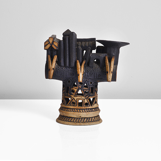 A black stoneware barrel pot with landscape made by Ian Godfrey