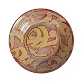 A red and gold earthenware charger made by Alan Caiger-Smith in 1974 sold at auction by Maak