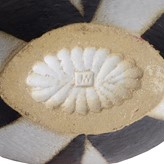 An impressed JW seal on a black and white stoneware pot made by John Ward