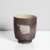 Earthenware, Ceramic raku fired dry brown body with a pale yellow and grey crackle glazed leaf motif, the interior with a pale yellow glaze with soft grey crackle, impressed IR seal