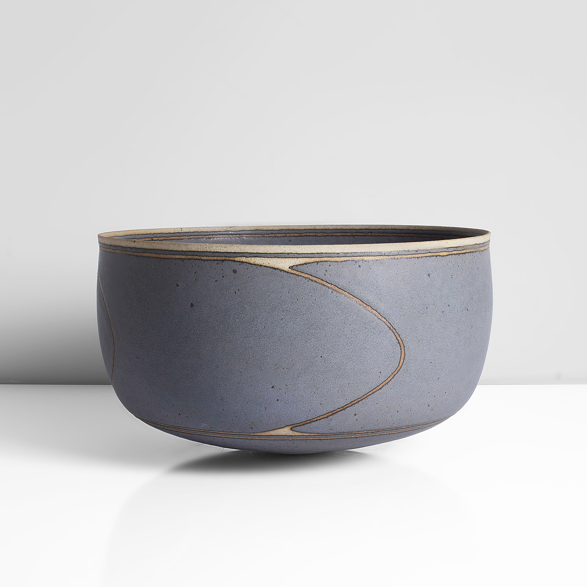 A grey blue stoneware bowl made by Alev Ebuzziya Siesbye in 1981 sold at auction by Maak