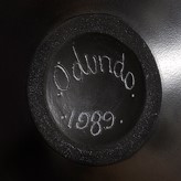 An incised signature and date on a vase made by Magdalene Odundo