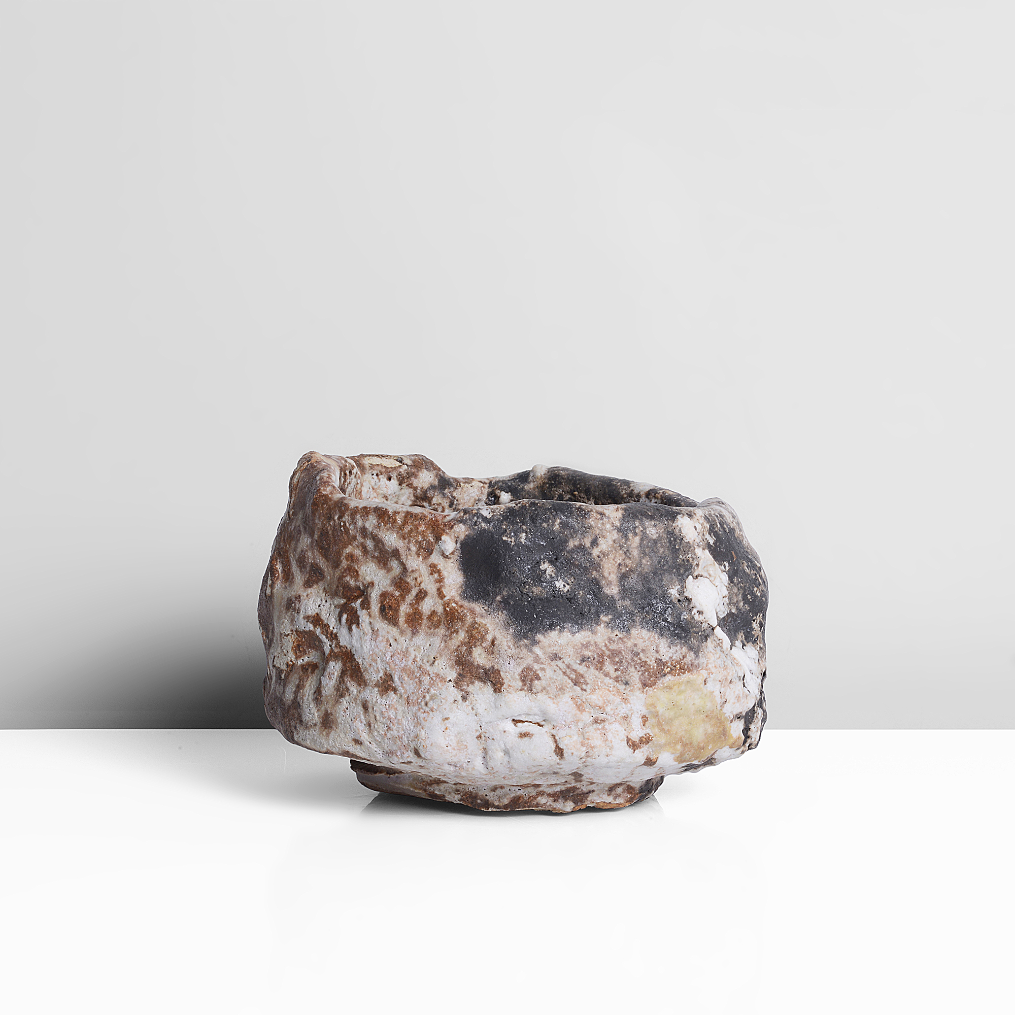 A mixed laminated clay tea bowl made by Ewen Henderson