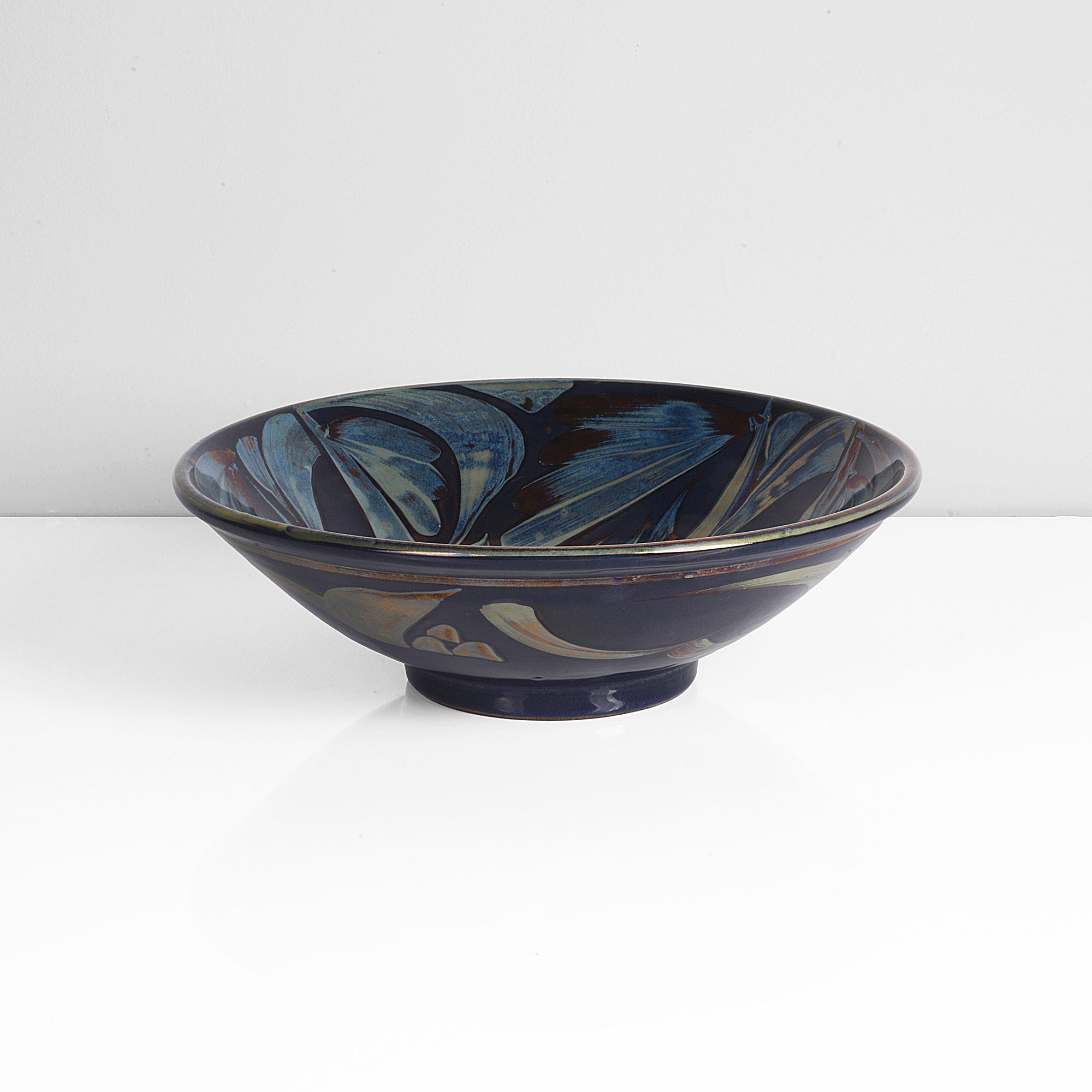 A blue earthenware open bowl made by Alan Caiger-Smith in 1989 sold at auction by Maak
