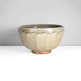 A green ash stoneware cut bowl made by Richard Batterham sold at auction by Maak Contemporary Ceramics